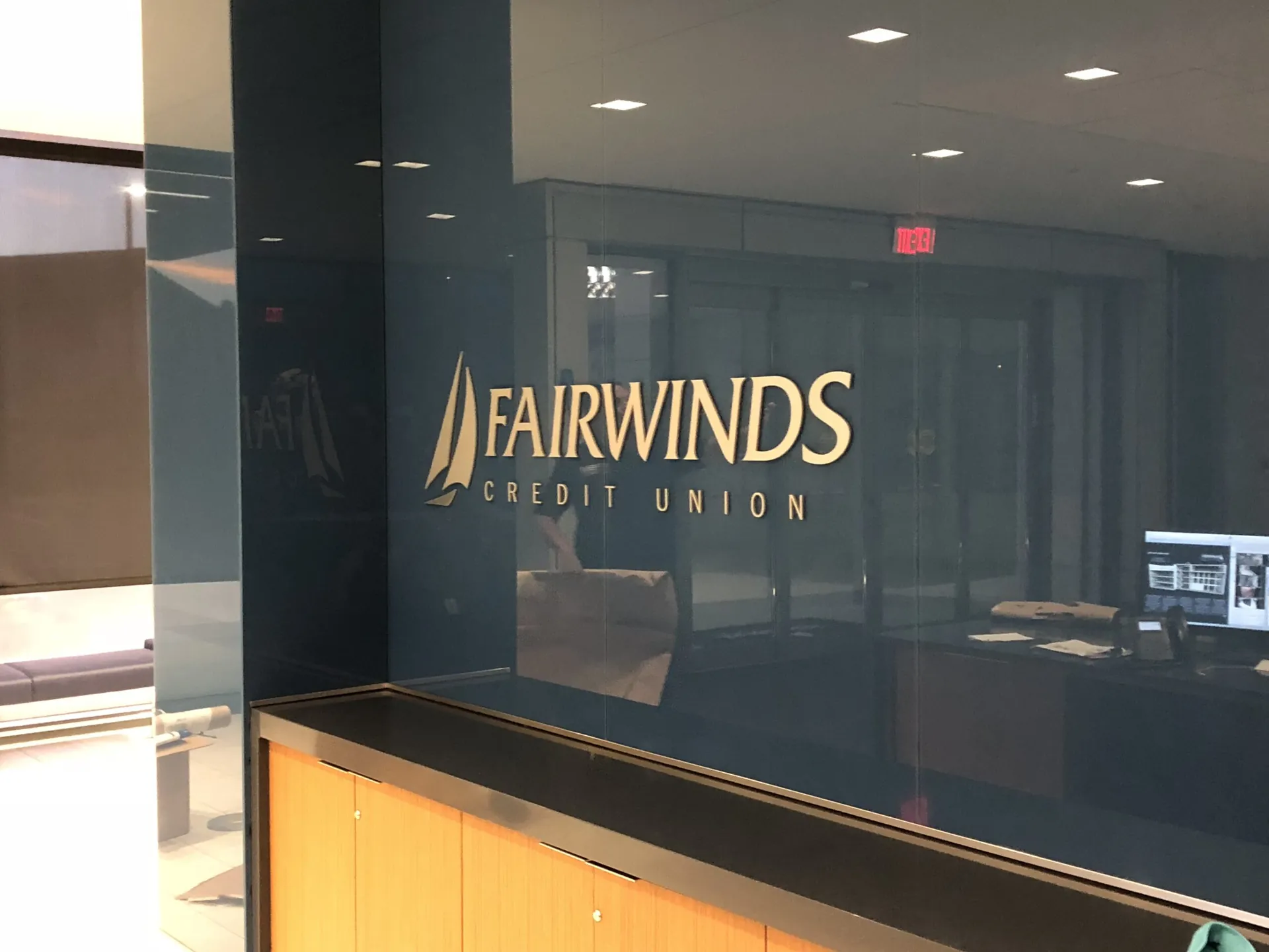 Dimensional lobby sign on an office reception wall