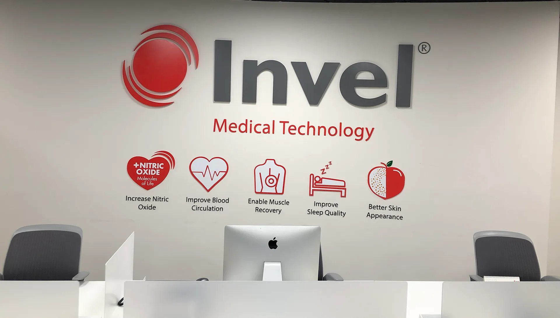 Invel Medical Technology lobby sign with dimensional letters and icons above a reception desk