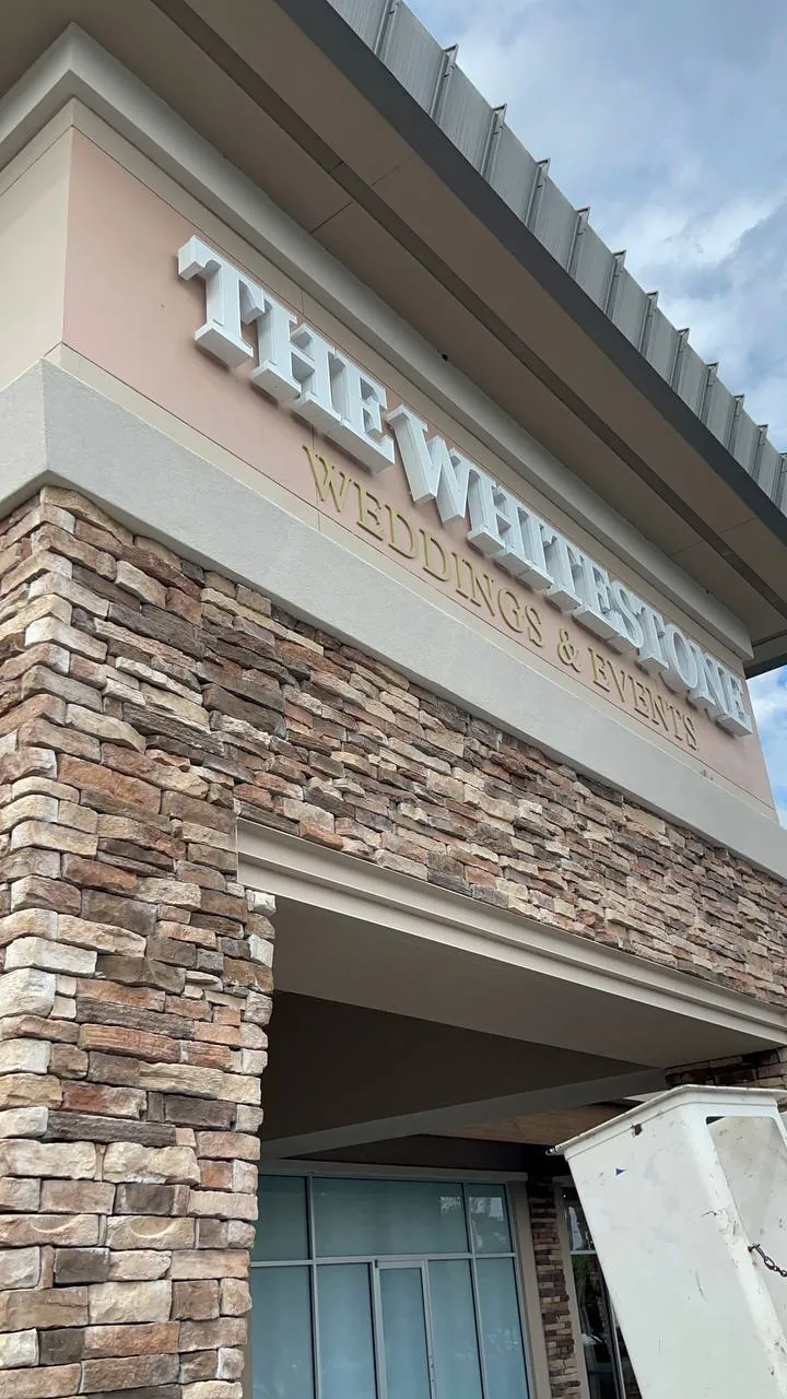The Whitestone Weddings & Events dimensional letters on a stone and stucco facade