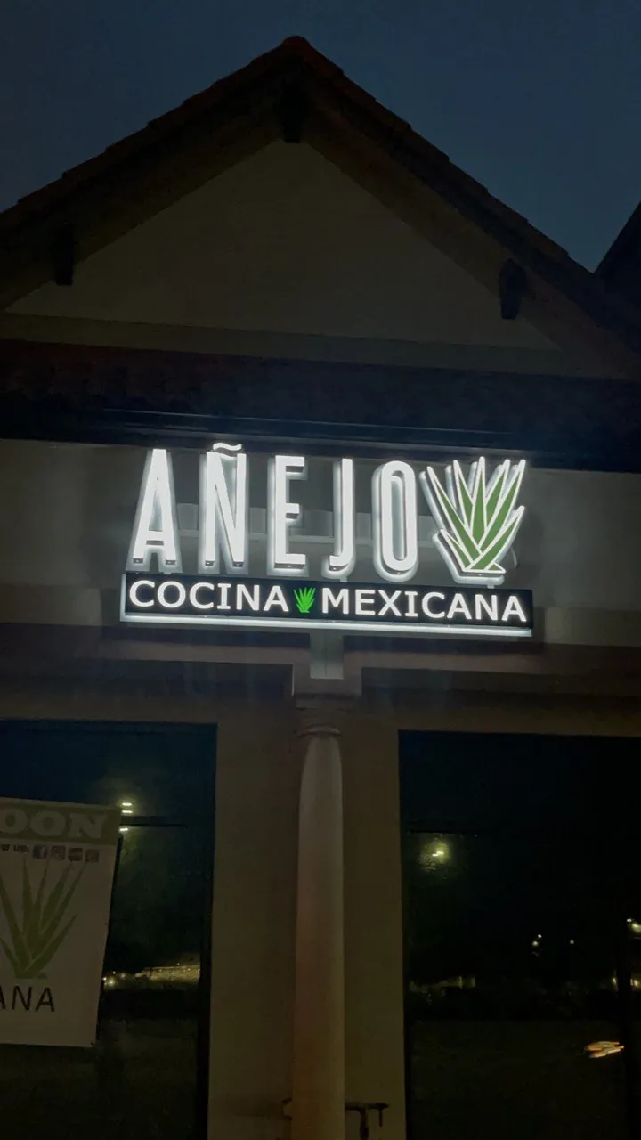 Añejo Cocina Mexicana channel letter sign illuminated at night