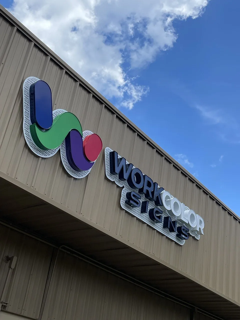 Work Color Signs dimensional logo sign on the facade of our Orlando shop