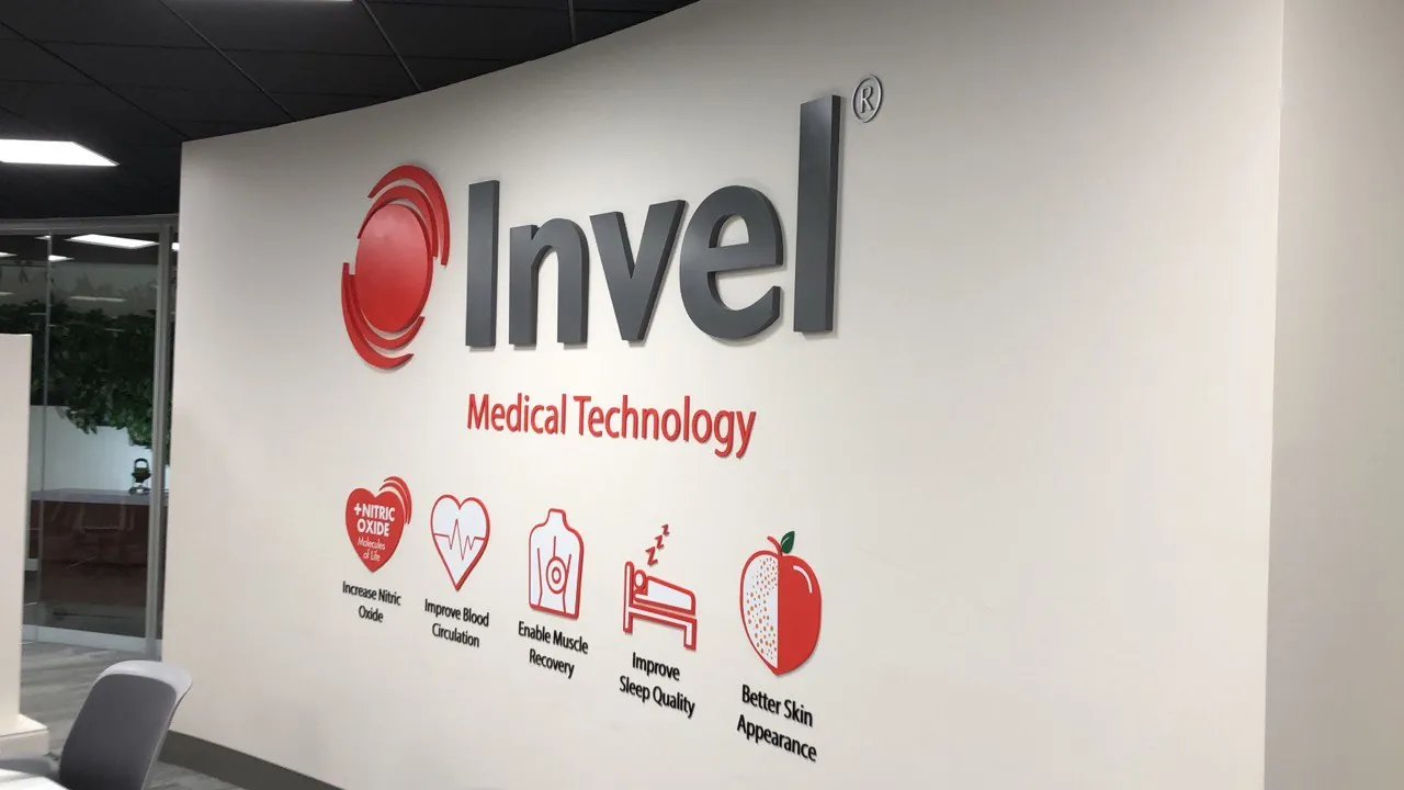 Invel Medical Technology red logo and icon graphics on a white lobby wall
